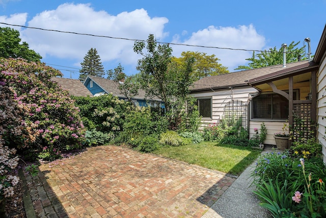 522 Lyon St, South Haven, MI 49090 - view of grassy yard with a patio