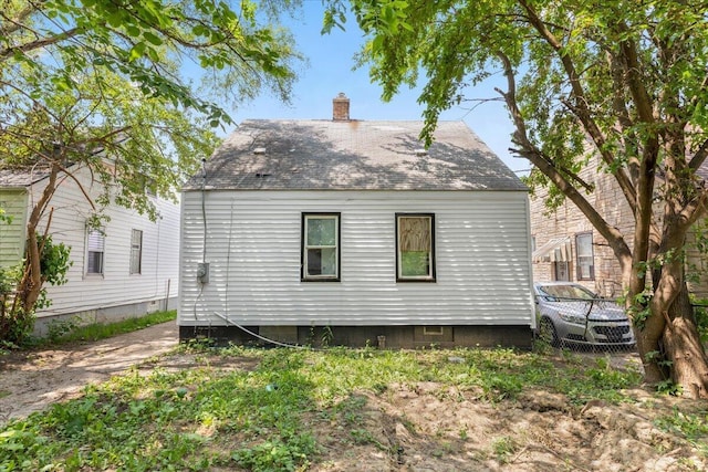 20192 Rogge St, Detroit, MI 48234 - rear view of house featuring a chimney and roof with shingles