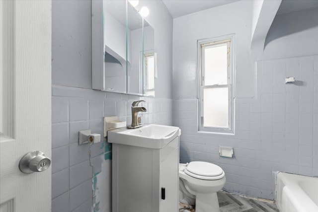 20192 Rogge St, Detroit, MI 48234 - full bath with tile walls, vanity, a tub, a wainscoted wall, and a shower