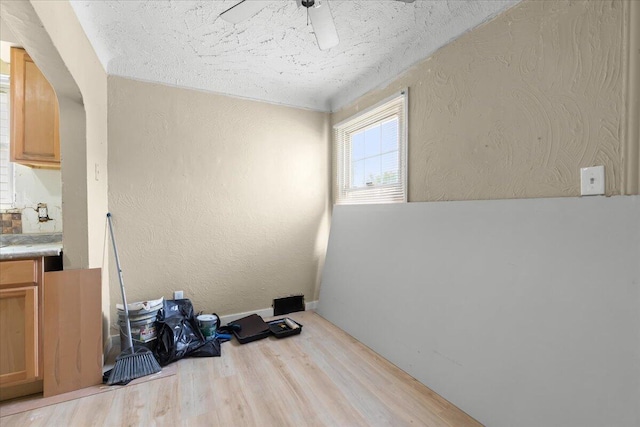 20192 Rogge St, Detroit, MI 48234 - spare room featuring wood finished floors, a textured wall, ceiling fan, and a textured ceiling
