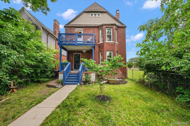 1769 W Warren Ave, Detroit, MI 48208 - view of front of home featuring brick siding, a chimney, and covered porch