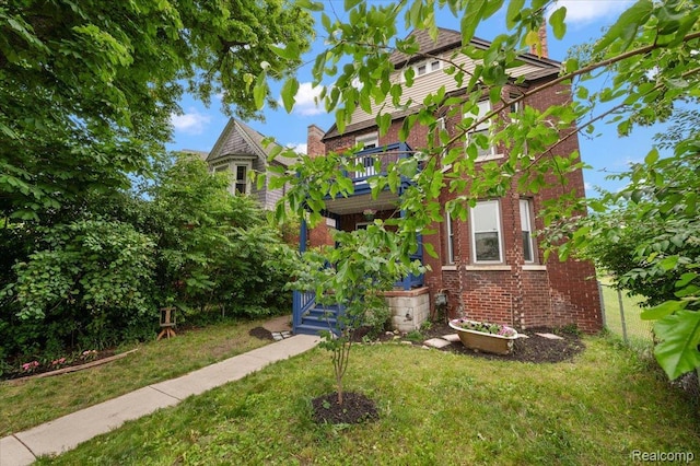 1769 W Warren Ave, Detroit, MI 48208 - victorian-style house with brick siding and a front yard