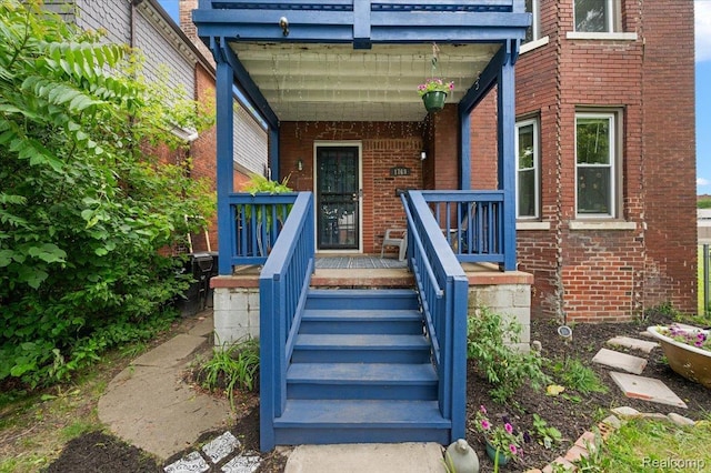 1769 W Warren Ave, Detroit, MI 48208 - doorway to property with brick siding and covered porch