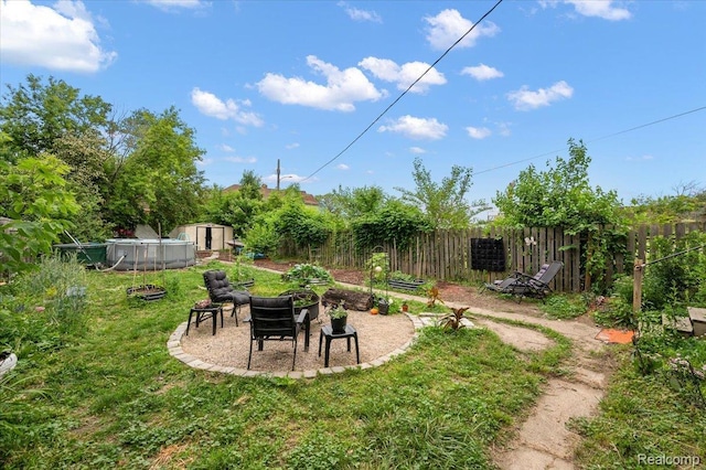 1769 W Warren Ave, Detroit, MI 48208 - view of yard featuring a shed and an outdoor fire pit