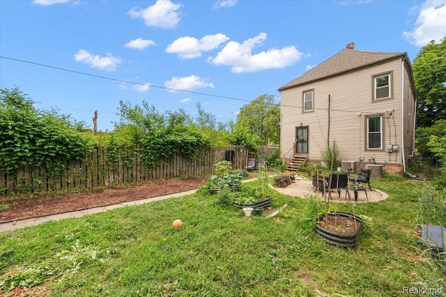 1769 W Warren Ave, Detroit, MI 48208 - fenced backyard featuring a patio and entry steps