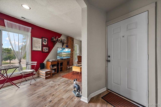 1769 W Warren Ave, Detroit, MI 48208 - entrance foyer with wood finished floors, a textured ceiling, and recessed lighting