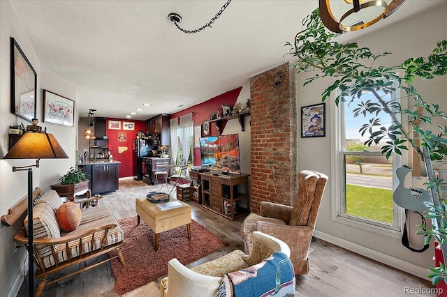 1769 W Warren Ave, Detroit, MI 48208 - living room with light wood-style floors and a textured ceiling