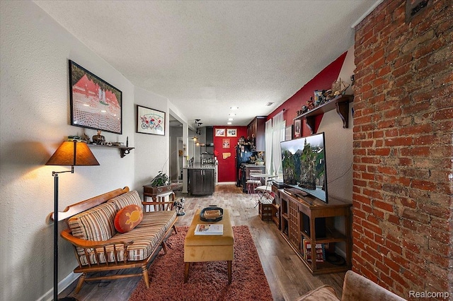 1769 W Warren Ave, Detroit, MI 48208 - living area with wood finished floors and a textured ceiling