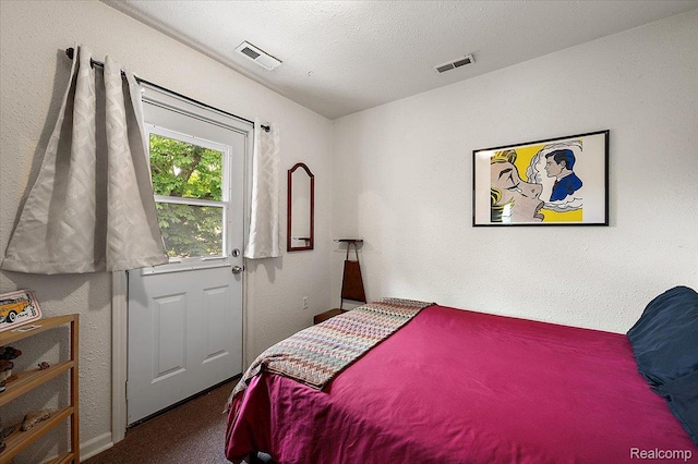 1769 W Warren Ave, Detroit, MI 48208 - bedroom featuring carpet flooring, a textured wall, and a textured ceiling