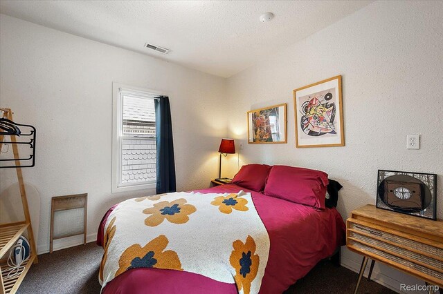 1769 W Warren Ave, Detroit, MI 48208 - carpeted bedroom featuring baseboards and a textured wall