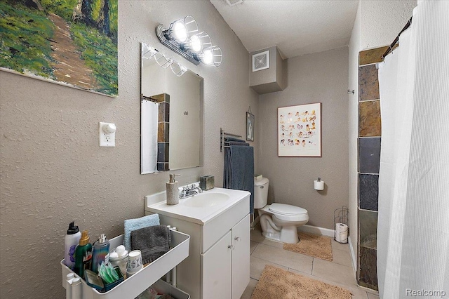 1769 W Warren Ave, Detroit, MI 48208 - bathroom with vanity, a tile shower, tile patterned floors, and a textured wall