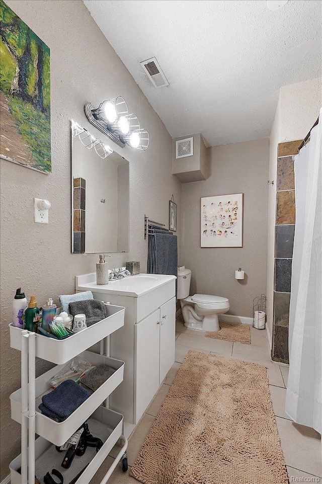 1769 W Warren Ave, Detroit, MI 48208 - full bath with tile patterned floors, a tile shower, vanity, and a textured ceiling