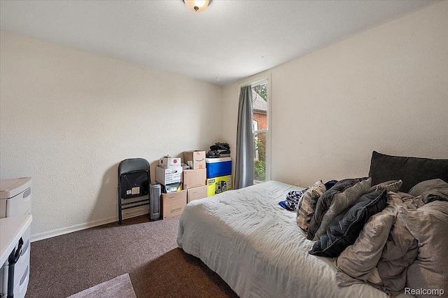 1769 W Warren Ave, Detroit, MI 48208 - carpeted bedroom with baseboards and a textured wall