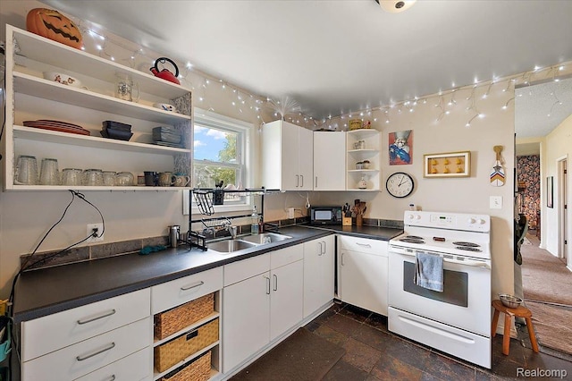 1769 W Warren Ave, Detroit, MI 48208 - kitchen with open shelves, white electric range oven, black microwave, dark countertops, and white cabinetry
