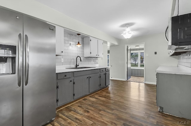 338 Cherry St, Blissfield, MI 49228 - kitchen featuring stainless steel appliances, gray cabinets, backsplash, dark wood-style floors, and light countertops