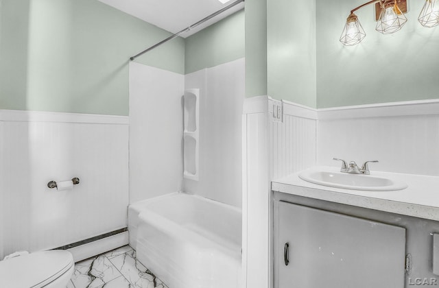 338 Cherry St, Blissfield, MI 49228 - bathroom with wainscoting, marble look tile flooring, washtub / shower combination, and vanity