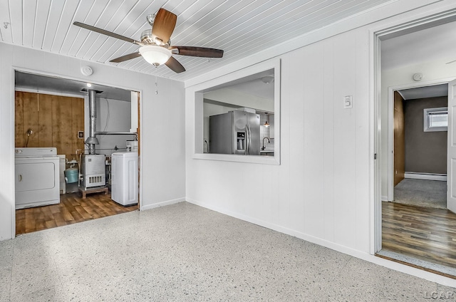 338 Cherry St, Blissfield, MI 49228 - interior space with baseboard heating and washing machine and dryer