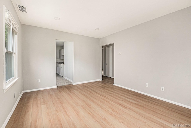 20846 Atlantic Ave, Warren, MI 48091 - unfurnished room with light wood-style flooring and baseboards