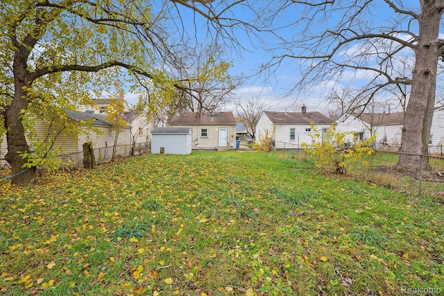 20846 Atlantic Ave, Warren, MI 48091 - fenced backyard with a storage unit