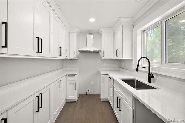 56350 Willow Creek Blvd, Utica, MI 48316 - kitchen with wall chimney range hood, dark wood-style flooring, recessed lighting, white cabinetry, and light stone counters
