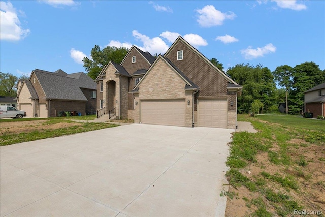 56350 Willow Creek Blvd, Utica, MI 48316 - view of front of property featuring concrete driveway, a garage, a front yard, stone siding, and brick siding