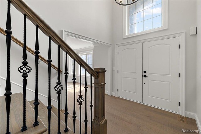 56350 Willow Creek Blvd, Utica, MI 48316 - foyer with wood finished floors, a towering ceiling, and stairway