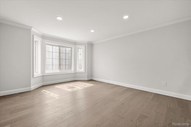 56350 Willow Creek Blvd, Utica, MI 48316 - empty room with ornamental molding, wood finished floors, and recessed lighting