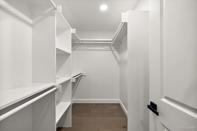 56350 Willow Creek Blvd, Utica, MI 48316 - walk in closet with dark wood finished floors