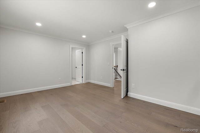56350 Willow Creek Blvd, Utica, MI 48316 - empty room featuring crown molding, recessed lighting, and wood finished floors