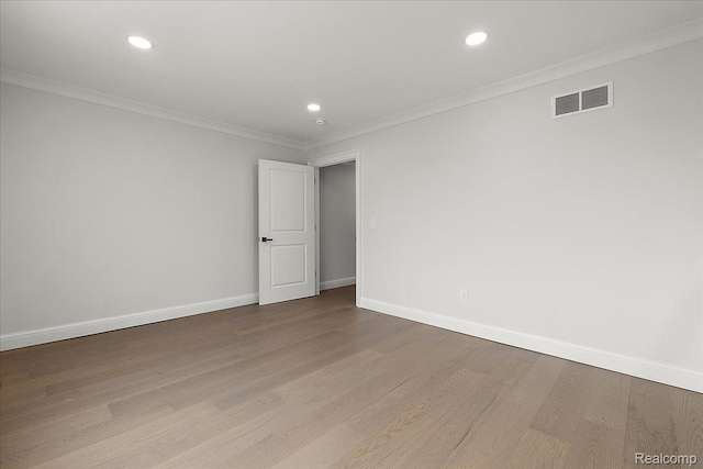 56350 Willow Creek Blvd, Utica, MI 48316 - spare room featuring wood finished floors, recessed lighting, and crown molding