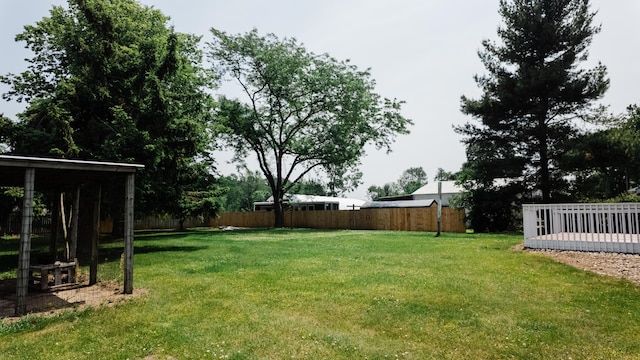 2250 Pray Rd, Charlotte, MI 48813 - view of yard featuring a deck