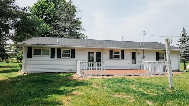 2250 Pray Rd, Charlotte, MI 48813 - rear view of house with a deck and a yard