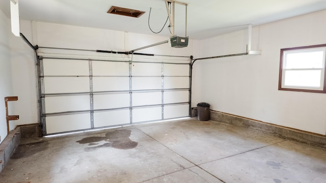2250 Pray Rd, Charlotte, MI 48813 - garage featuring a garage door opener