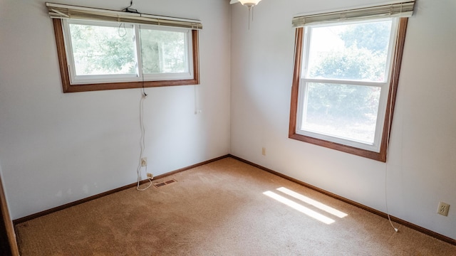 2250 Pray Rd, Charlotte, MI 48813 - unfurnished room with light colored carpet and baseboards