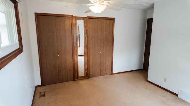 2250 Pray Rd, Charlotte, MI 48813 - unfurnished bedroom with carpet floors and a ceiling fan