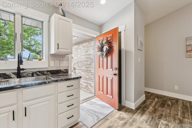 3328 S Vassar Rd, Burton, MI 48519 - kitchen with wood finished floors and white cabinets