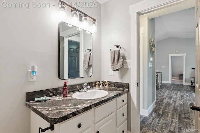3328 S Vassar Rd, Burton, MI 48519 - bathroom featuring vanity, wood finished floors, and vaulted ceiling