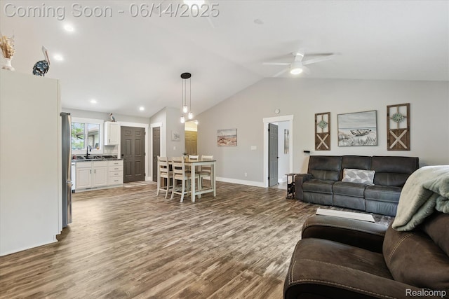 3328 S Vassar Rd, Burton, MI 48519 - living room featuring wood finished floors, vaulted ceiling, a ceiling fan, and recessed lighting