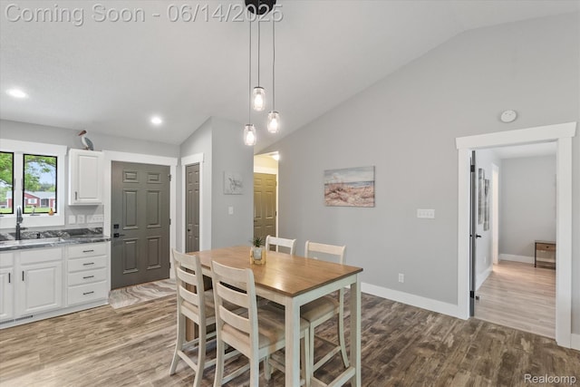 3328 S Vassar Rd, Burton, MI 48519 - dining room with vaulted ceiling, light wood-type flooring, and recessed lighting