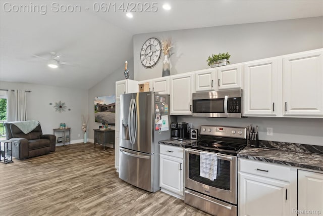 3328 S Vassar Rd, Burton, MI 48519 - kitchen with stainless steel appliances, lofted ceiling, white cabinetry, light wood-style floors, and ceiling fan