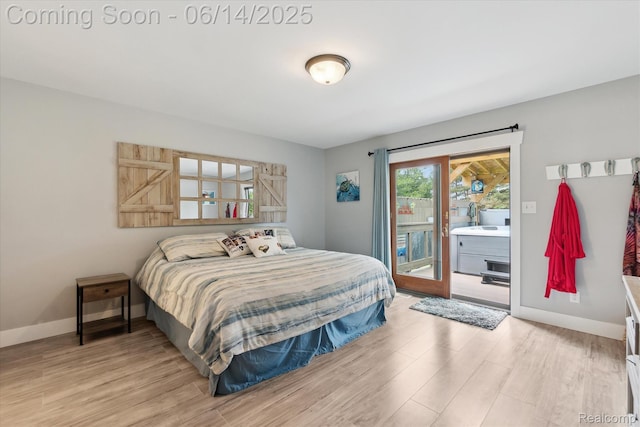 3328 S Vassar Rd, Burton, MI 48519 - bedroom featuring access to exterior and light wood-style floors