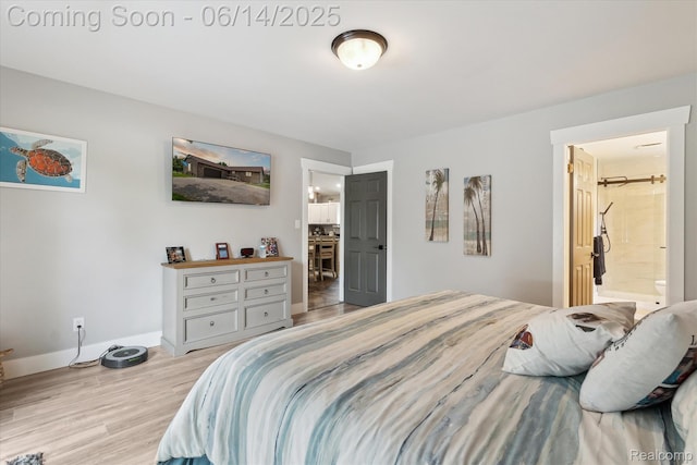 3328 S Vassar Rd, Burton, MI 48519 - bedroom with light wood finished floors and connected bathroom