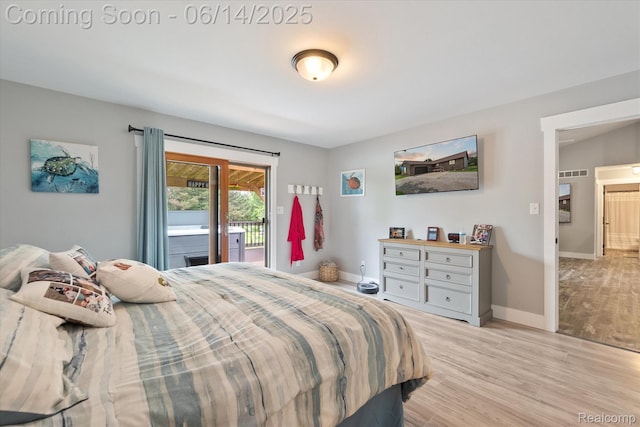 3328 S Vassar Rd, Burton, MI 48519 - bedroom featuring access to outside and light wood finished floors