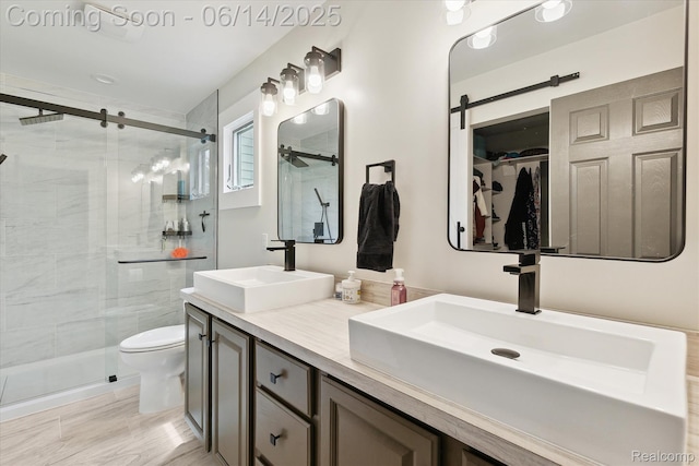 3328 S Vassar Rd, Burton, MI 48519 - bathroom featuring double vanity, a stall shower, and a spacious closet