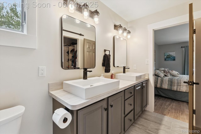 3328 S Vassar Rd, Burton, MI 48519 - ensuite bathroom featuring double vanity and toilet
