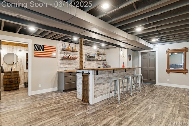 3328 S Vassar Rd, Burton, MI 48519 - indoor bar featuring baseboards and wood finished floors