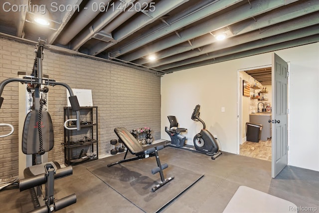 3328 S Vassar Rd, Burton, MI 48519 - workout area with brick wall