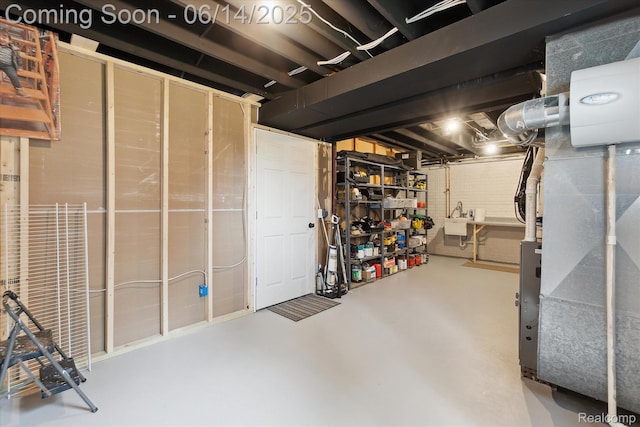 3328 S Vassar Rd, Burton, MI 48519 - unfinished below grade area featuring a sink and heating unit