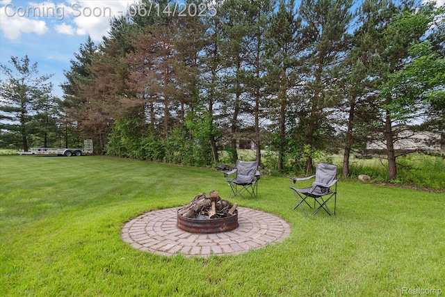 3328 S Vassar Rd, Burton, MI 48519 - view of green lawn with a fire pit