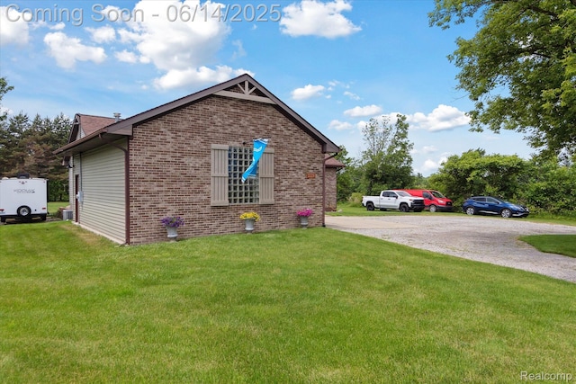 3328 S Vassar Rd, Burton, MI 48519 - view of side of home featuring brick siding and a yard